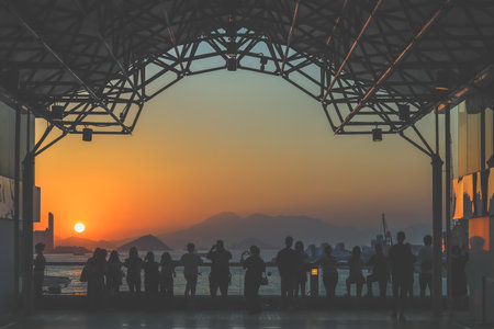 amber toned interior shows visitors seated along a corridor, Tsim Sha Tsui Nov 16 2025のeditorial素材