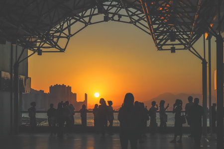 amber toned interior shows visitors seated along a corridor, Tsim Sha Tsui Nov 16 2025のeditorial素材