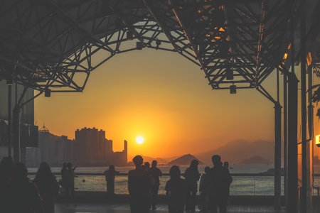 amber toned interior shows visitors seated along a corridor, Tsim Sha Tsui Nov 16 2025のeditorial素材