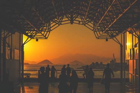 amber toned interior shows visitors seated along a corridor, Tsim Sha Tsui Nov 16 2025のeditorial素材
