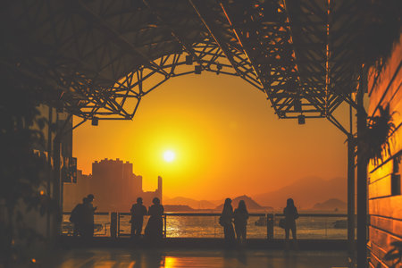 amber toned interior shows visitors seated along a corridor, Tsim Sha Tsui Nov 16 2025のeditorial素材