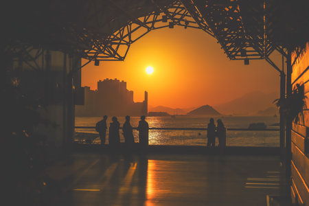 amber toned interior shows visitors seated along a corridor, Tsim Sha Tsui Nov 16 2025のeditorial素材