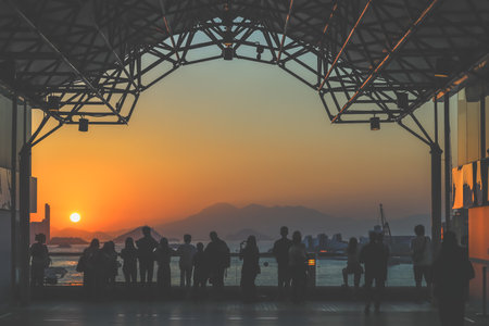 amber toned interior shows visitors seated along a corridor, Tsim Sha Tsui Nov 16 2025のeditorial素材