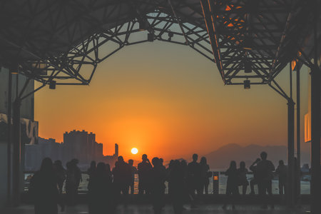 amber toned interior shows visitors seated along a corridor, Tsim Sha Tsui Nov 16 2025のeditorial素材