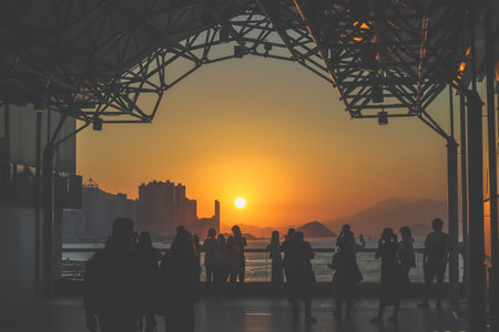 amber toned interior shows visitors seated along a corridor, Tsim Sha Tsui Nov 16 2025のeditorial素材