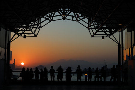 amber toned interior shows visitors seated along a corridor, Tsim Sha Tsui Nov 16 2025のeditorial素材