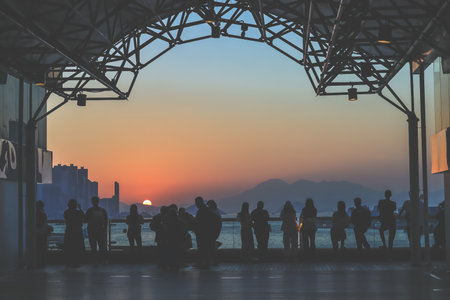 amber toned interior shows visitors seated along a corridor, Tsim Sha Tsui Nov 16 2025のeditorial素材