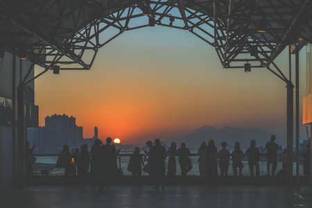 amber toned interior shows visitors seated along a corridor, Tsim Sha Tsui Nov 16 2025のeditorial素材