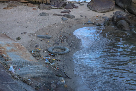 Beach scene depicting pollution with discarded objects Sept 14 2025のeditorial素材