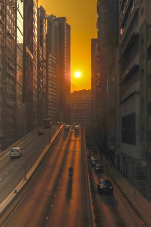 Urban Sunset Alignment on Busy Hong Kong Street Dec 6 2025