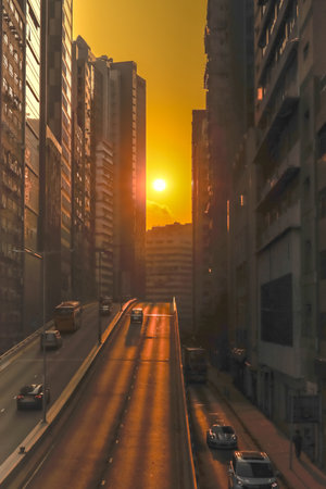 Urban Sunset Alignment on Busy Hong Kong Street Dec 6 2025のeditorial素材
