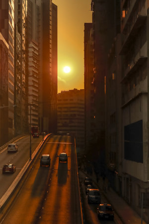 Urban Sunset Alignment on Busy Hong Kong Street Dec 6 2025のeditorial素材