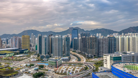 Scenic Kai Tak waterfront promenade with modern city skyline Dec 14 2025のeditorial素材