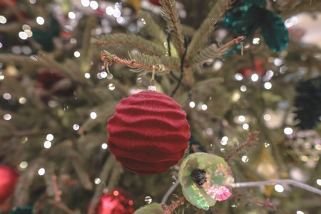 Seasonal holiday decoration featuring illuminated Christmas tree ornaments