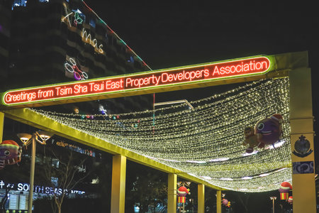 Festive holiday lights and ornaments illuminating city streetsのeditorial素材