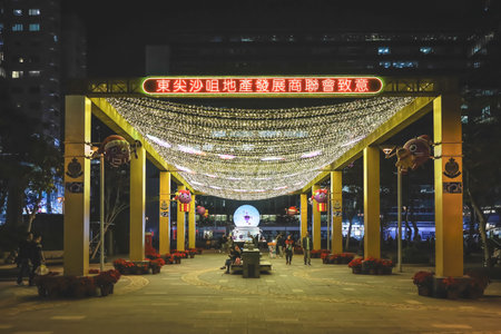 Festive holiday lights and ornaments illuminating city streets
