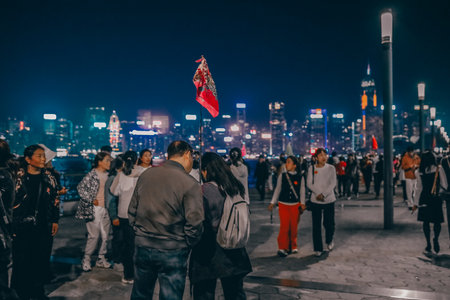 Tourist enjoying panoramic view of Victoria Harbor promenadeのeditorial素材
