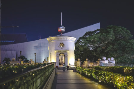 Historic 1881 Heritage building glowing against night skylineのeditorial素材