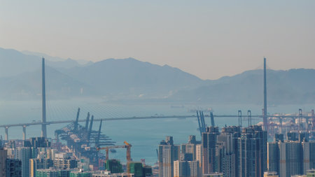 Iconic cable-stayed bridge spanning Victoria Harbour skyline view Dec 17 2025