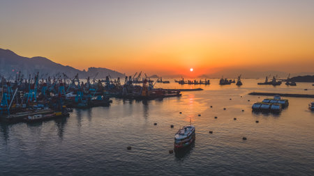 Scenic sunset over Victoria Harbor from typhoon shelter area Dec 24 2025のeditorial素材