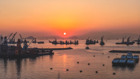 Scenic sunset over Victoria Harbor from typhoon shelter area Dec 24 2025のeditorial素材