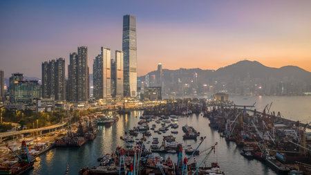Scenic sunset over Victoria Harbor from Yau Ma Tei Pier Dec 24 2025のeditorial素材