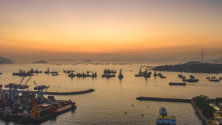 Scenic sunset over Victoria Harbor from Yau Ma Tei Pier Dec 24 2025