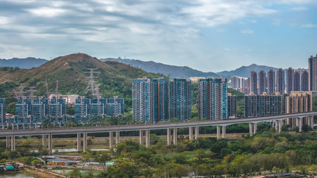 Modern housing estate contrasting with traditional village scenery Dec 20 2025のeditorial素材