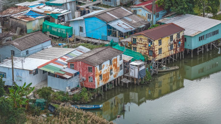 view of a riverside community of colorful, weathered stilt houses b Dec 20 2025のeditorial素材