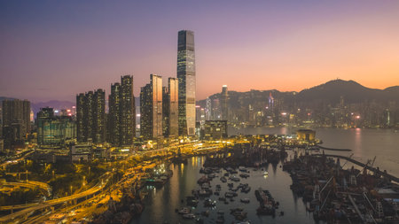 Scenic sunset over Victoria Harbor from Yau Ma Tei Pier Dec 24 2025