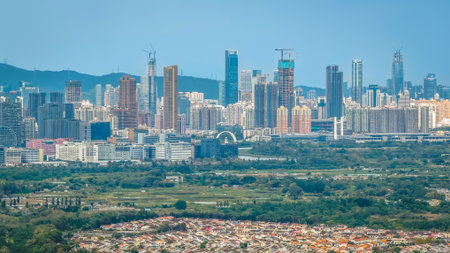 clouds casting dramatic tone over wetlands and city Dec 20 2025のeditorial素材