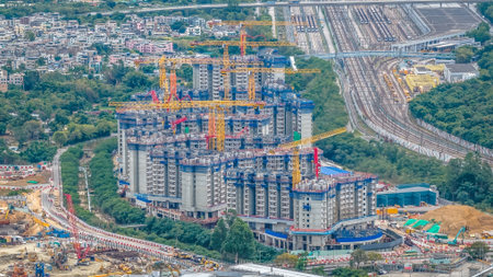 Excavators and cranes working on large-scale housing project Dec 20 2025