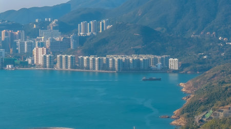 A tranquil coastal cityscape featuring tall apartment blocks along Jan 11 2026のeditorial素材