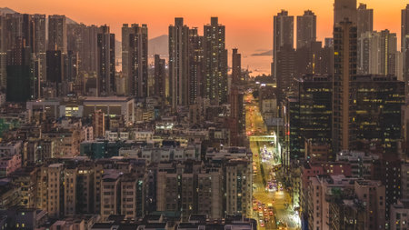 Bustling urban street glowing under vibrant evening city lights Jan 9 2026のeditorial素材