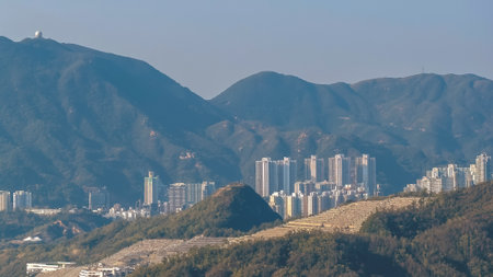 Serene hillside cemetery overlooking tranquil waters and green landscape Jan 11 2026のeditorial素材