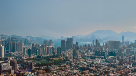 Clear daytime sunlight highlights Middle Kowloon buildings and cityscape Jan 15 2026