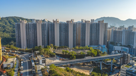Residential towers glow under warm evening Kowloon skyline Jan 11 2026