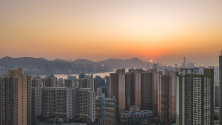 glowing sky highlights Hong Kong buildings and distant mountains Jan 18 2026