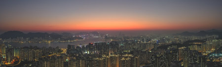 Soft evening colors illuminate dense urban landscape of Kowloon Jan 18 2026