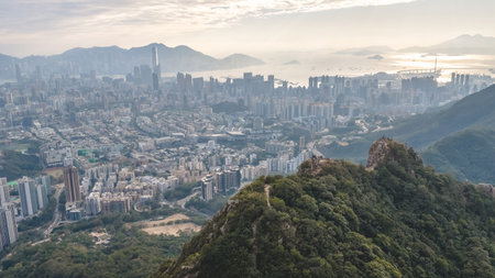 Mountain trail overlooks packed residential towers across Kowloon Jan 25 2026のeditorial素材