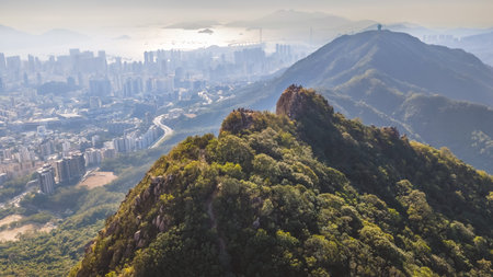 Famous mountain ridge rises above dense urban skyline Jan 25 2026のeditorial素材