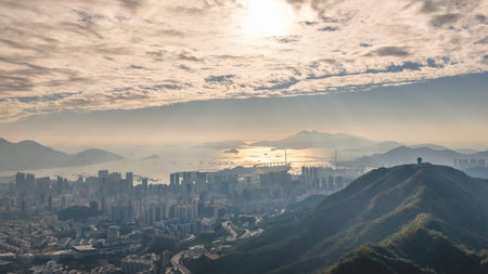 Modern towers overlook harbour waters beneath expansive glowing sky Jan 25 2026のeditorial素材
