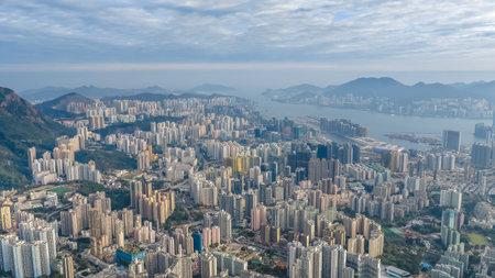 Dense residential towers contrast strongly with natural wooded slopes Jan 25 2026