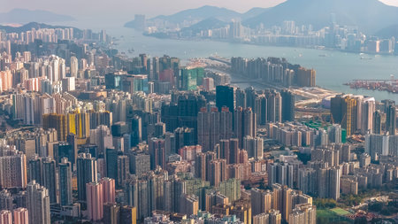 Packed residential towers rise tightly across steep urban hillside Jan 25 2026のeditorial素材