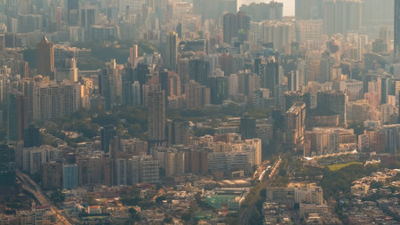 Layered urban towers soften gradually beneath atmospheric distant peaks Jan 25 2026のeditorial素材