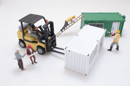 Tiny construction figurines coordinate placement of modular containers