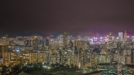 Illuminated towers rise over bustling streets in Kowloon Feb 6 2026