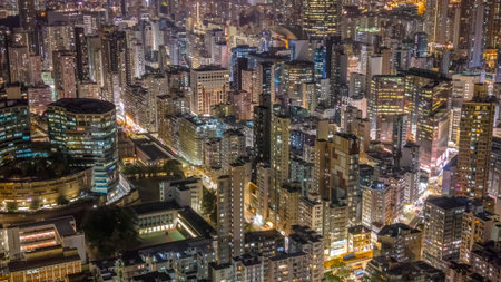 Dense illuminated towers rise above bustling nighttime district Feb 6 2026