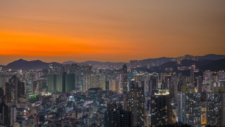 Warm evening glow highlights towers overlooking vibrant district Feb 6 2026のeditorial素材