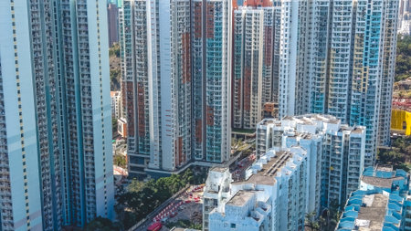 housing blocks stand beside mountains and urban skyline Feb 11 2026のeditorial素材